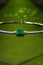Sterling silver tennis bracelet with lab-grown emerald center stone