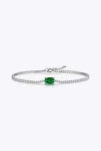 Sterling silver tennis bracelet with lab-grown emerald center stone