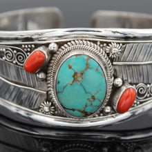 Sterling silver turquoise open bracelet with coral accents and floral details
