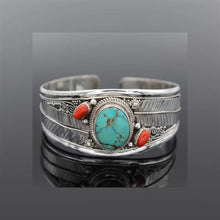 Sterling silver turquoise open bracelet with oval turquoise stone and coral accents