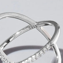 Sterling silver X-shaped ring with pave inlaid zircon stones