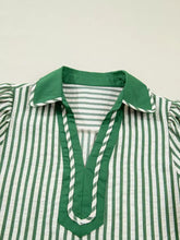 Green and white vertically striped short bubble sleeve blouse with solid green collar and split v-neck trim