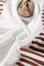 A soft white ribbed knit stripe colorblock patchwork contrast stitching sweatshirt with brown and white striped sleeves machine wash cold care instructions