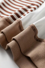Stripe colorblock patchwork contrast stitching sweatshirt in tan ribbed knit fabric with rolled cuff and care instructions machine wash cold