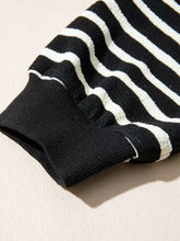 Black and white striped knit sleeve with ribbed cuffs on slightly stretchy stripe contrast merry letter christmas print sweatshirt with care instructions for tumble dry