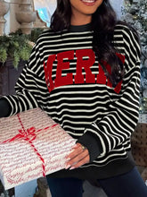 Black and white striped slightly stretchy sweatshirt with bold red merry lettering tumble dry care instructions included