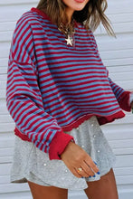 Red and light blue striped cropped sweatshirt with ruffled hem and cuffs, slightly stretchy and machine wash care instructions