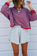 Red and gray striped long-sleeved oversize sweatshirt with ruffled cuffs and ribbed trim, slightly stretchy and machine wash