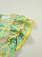 A vibrant green and white stripe floral ruffle short sleeve blouse with yellow scalloped ruffle details on neckline and sleeves
