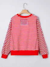 Stripe holly jolly sequin graphic drop shoulder long sleeve top with red and white stripes and slightly stretchy material