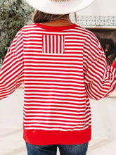 Back view of red and white striped stripe holly jolly sequin graphic long sleeve top with quilted pocket in slightly stretchy material, machine wash cold