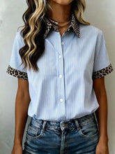 Blue and white striped short sleeve button-up shirt with leopard print collar and sleeve cuffs for casual wear