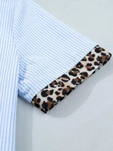Blue and white striped short sleeve shirt with leopard print cuffs featuring a contrast collar design