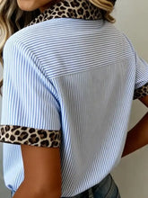 Blue and white striped short sleeve shirt with leopard print collar and sleeve cuffs in cotton blend fabric
