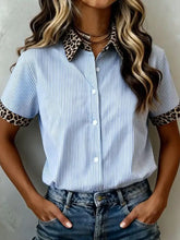 Light blue and white striped short sleeve button-up shirt with leopard print collar and sleeve cuffs