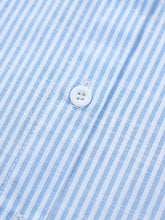 A white four-hole button on a light blue and white striped cotton short sleeve stripe leopard contrast collar shirt