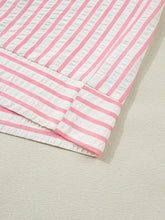 Pink and white striped ruffled blouse with floral embroidered puff sleeves and textured quilted finish