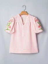 Pink and white vertically striped short-sleeved blouse with floral embroidered puff sleeves and v neck design