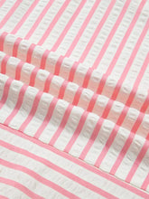 Pink and white striped textured fabric with subtle ruched pattern on floral embroidered puff sleeve v neck blouse