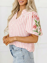 Pink and white vertically striped blouse with floral embroidered puff sleeves and v neck in lightweight fabric