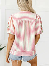 Pink and white vertically striped blouse with floral embroidered puff sleeves and v neck in lightweight fabric