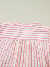 A pink and white striped dress with floral embroidered puff sleeves and a gathered neckline for elegant wear