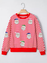 Red and white striped christmas long sleeve top with sequin santa faces in various hat colors slightly stretchy machine wash