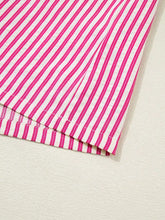 A vibrant pink and white striped ruffled short sleeve blouse with a crisp, clean finish and shirred yoke detail