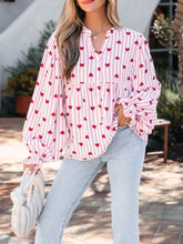 Stripe textured heart print long flounce sleeve shirt in pink and white with red hearts and puffy sleeves tied at cuffs
