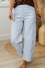 Blue and white vertically striped wide-leg denim pants designed as striped barrel leg jeans for casual wear