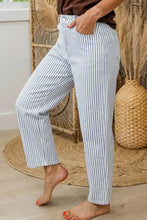 Striped barrel leg jeans in blue and white cotton featuring a relaxed fit with tapered barrel leg design