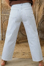 Striped barrel leg jeans in light blue and white vertical stripes made of denim fabric with a wide-leg design