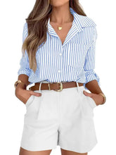 Blue and white vertically striped long sleeve button-down shirt with rolled sleeves in lightweight fabric