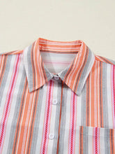 A vibrant short sleeve striped button shirt with coral white gray and red vertical stripes and subtle chain pattern edges
