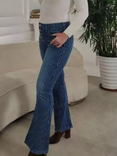 Blue denim flare jeans with white vertical stripes featuring a striped button fly flare design