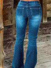 Blue pinstripe denim flare jeans with faded wash and white stitching featuring a striped button fly flare design