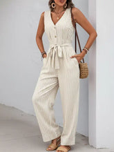 Beige and white striped wide leg jumpsuit with v-neck and self-tie waist