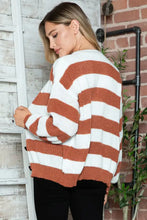 Rust and white striped button long sleeve sweater with black buttons