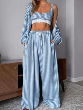 Woman in Striped Cami & Pants Lounge Set with light blue white stripes
