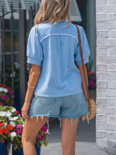 Light blue short-sleeved blouse with white trim and striped frilled collar short perfect for casual wear