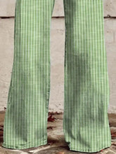 Green striped high-waisted wide leg jeans with a subtle grid pattern in a wide leg design