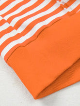 Striped long sleeve casual sweatshirt with orange and white striped ribbed knit cuff in soft fabric