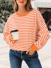 Striped long sleeve casual sweatshirt in orange and white with ruffled cuffs made of soft cotton for everyday wear