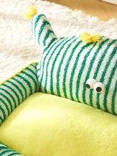 Striped monster design pet nest with green white stripes yellow pom poms