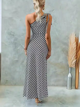 Black and white striped one shoulder asymmetrical maxi dress with high slit