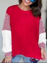 Red long-sleeved striped patchwork sleeve colorblock sweatshirt with slightly stretchy fabric and easy machine wash care instructions
