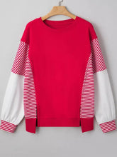 Vibrant red striped patchwork sleeve colorblock sweatshirt with slightly stretchy fabric and machine wash care instructions