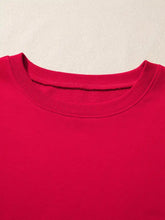 Vibrant red striped patchwork sleeve colorblock sweatshirt with ribbed knit collar smooth slightly stretchy fabric and machine wash care instructions