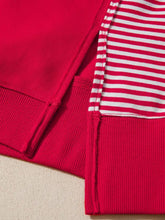 Red ribbed knit striped patchwork sleeve colorblock sweatshirt with a slightly stretchy fabric and machine wash care instructions