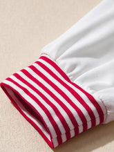 Striped patchwork sleeve colorblock sweatshirt with red and white striped cuff on soft slightly stretchy white fabric machine wash care instructions